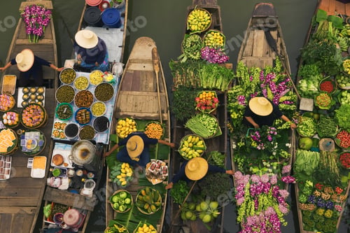 Preview: Aerial view of a floating market on a canal in Bangkok, local boats laden with fresh food, moored