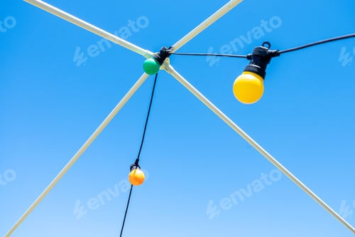 Preview: decorative colored bulbs with blue sky in the background