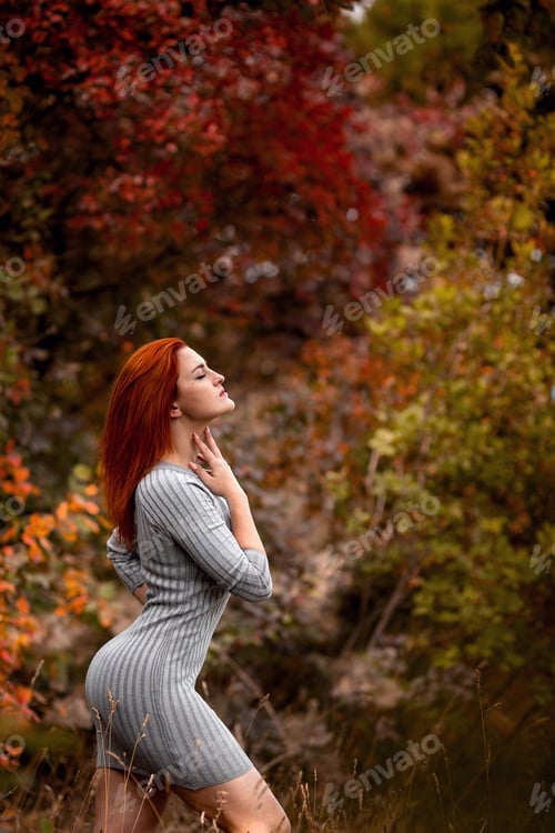 Preview: Beautiful young woman enjoys the autumn warmth