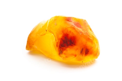 Preview: Natural amber. A piece of yellow opaque natural amber on white background