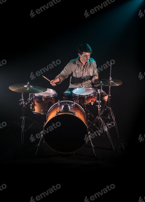Preview: musician playing drums, black background and beautiful soft light