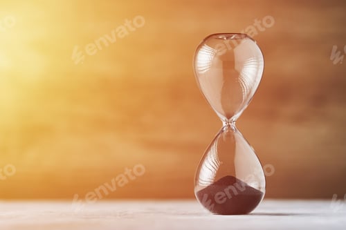 Preview: Hourglass on the wooden background with copy space. Concept of running out of time and deadline