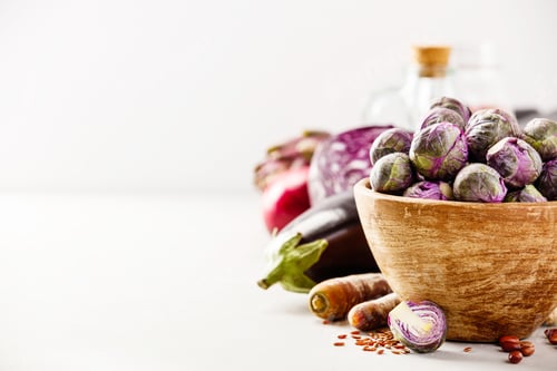 Preview: Purple Brussels sprouts in a wooden bowl