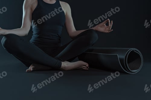 Preview: Woman Meditating with Yoga Mat in Studio