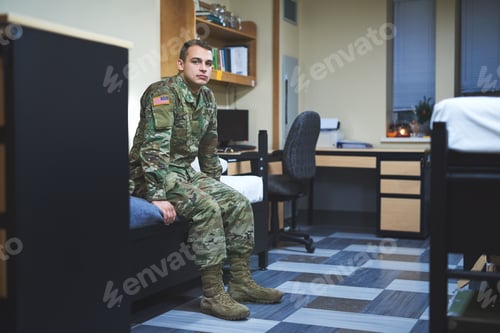 Preview: Shot of a young soldier sitting on his bed in the dorms of a military academy