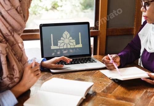 Preview: Islamic women discussing and using laptop for working