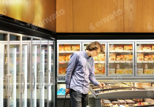 Preview: Man Choosing Frozen Food From A Supermarket Freezer
