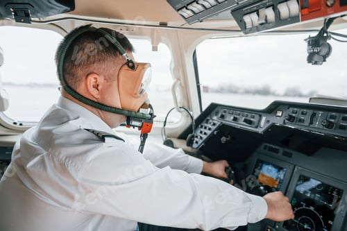 Preview: In oxygen mask. Pilot on the work in the passenger airplane. Preparing for takeoff
