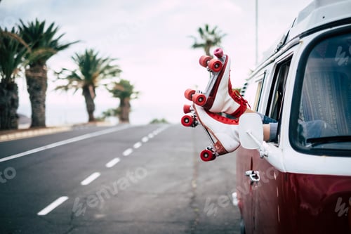 Preview: Travel and freedom concept with classic skate and van with long asphalt straight road in background