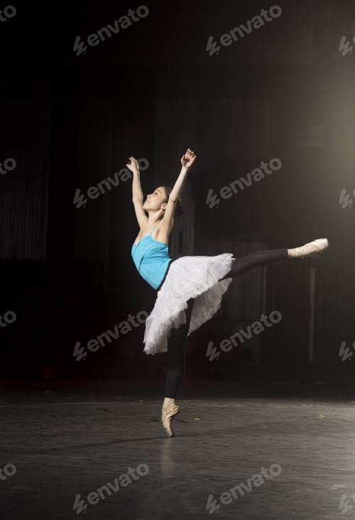 Preview: One Ballerina Practising On Stage. Standing On One Leg.