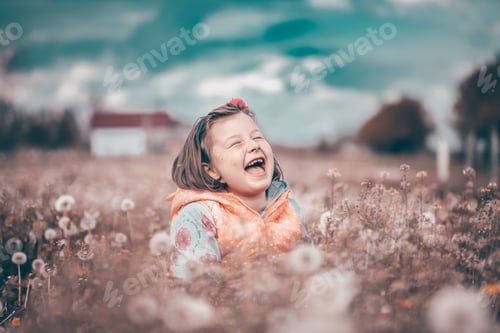 Preview: Cute little girl on the meadow in spring day