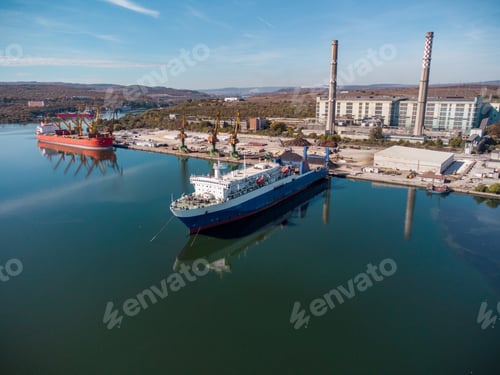 Preview: Aerial view of big cargo ship bulk carrier is loaded with coal in port