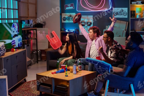 Preview: Group of Young Multiethnic Friends Watching Football Game and Celebrating Victory