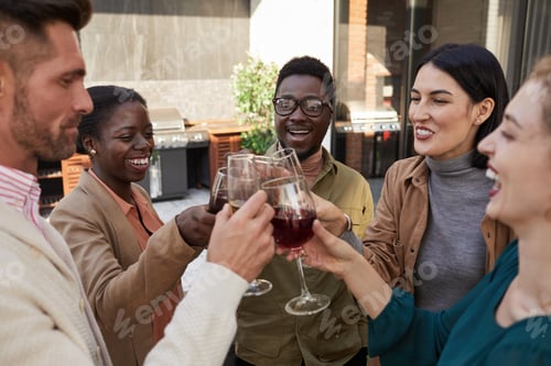 Preview: Small Group of Friends Toasting at Outdoor Party