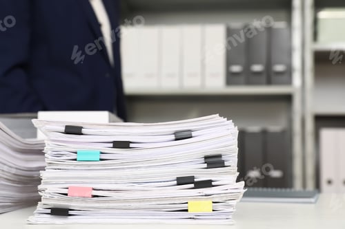 Preview: Stack of documents with paper clips on office desk. Space for text
