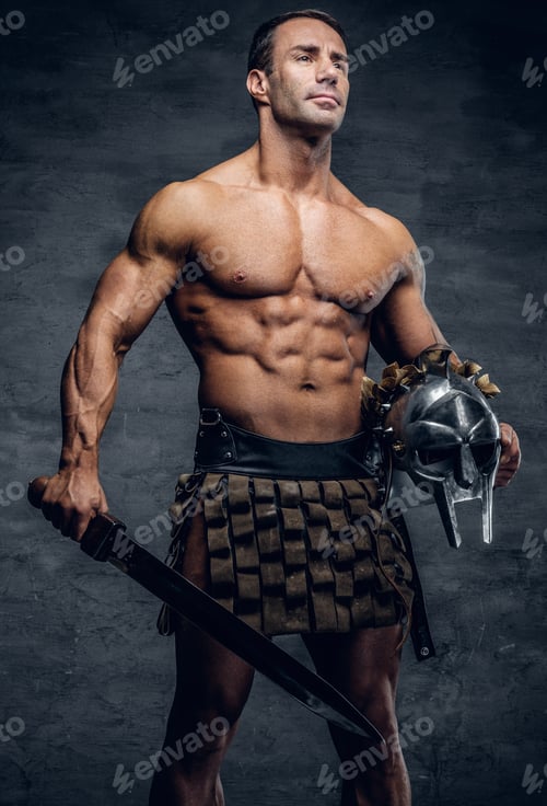 Preview: Middle age, muscular male holds silver gladiator helmet and an i
