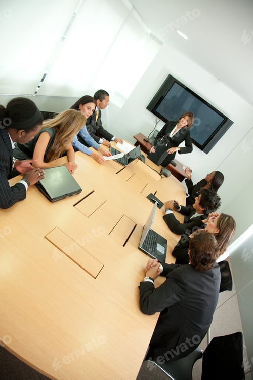 Preview: Group Of Business People In A Conference Room