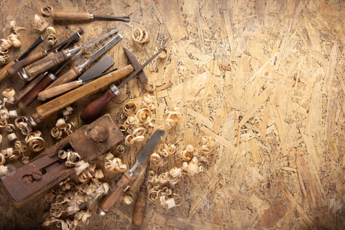 Preview: Plane jointer carpenter or joiner tool and wood shavings. Woodworking tools at wooden table