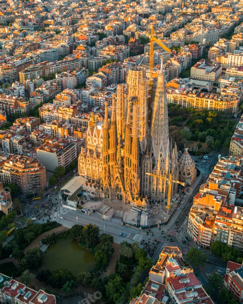 Preview: Aerial view of Barcelona Eixample residential district and Sagrada Familia Basilica at sunrise