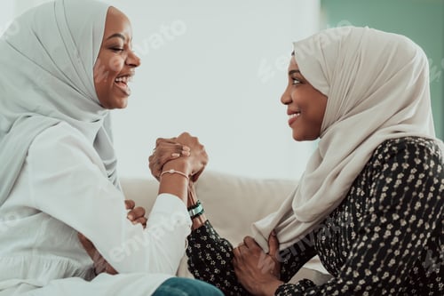 Preview: African woman arm wrestling conflict concept, disagreement and confrontation wearing traditional
