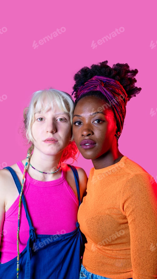 Preview: Portrait of two diverse women friends posing isolated copy space background