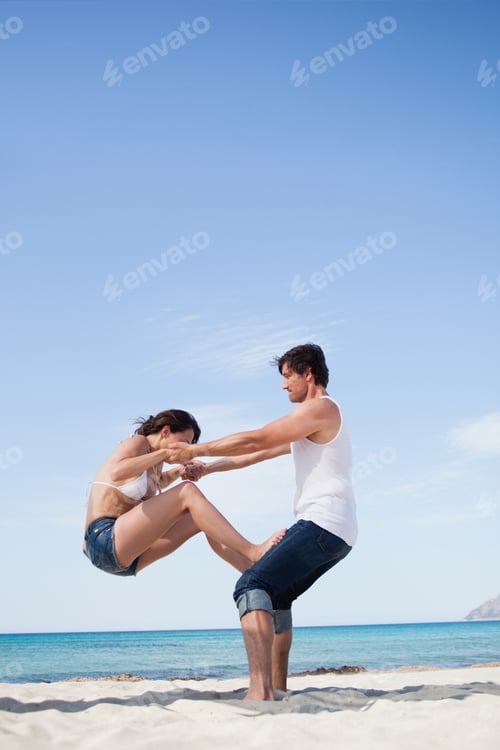 Preview: couple on beach playing