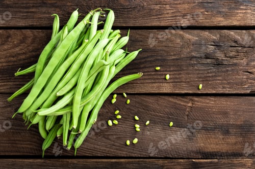 Preview: Fresh green beans on dark wooden rustic background top view copy space flat lay