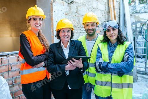 Preview: Group of workers of a work posing on camera