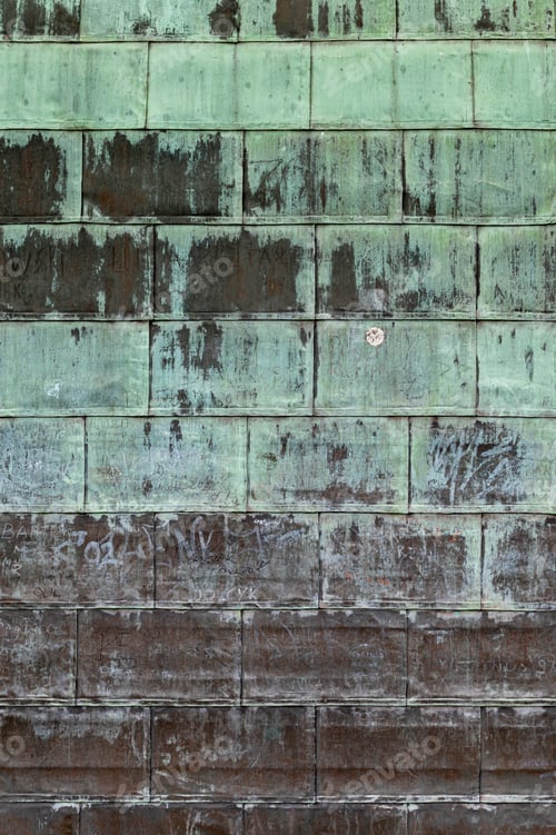 Preview: Oxidized copper folded sheet metal on roof. Copper wall texture background with marks and scrawls.