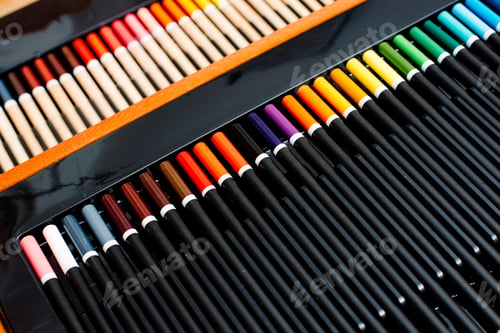 Preview: Set of colored pencils arranged in gradient with artistic copy space.