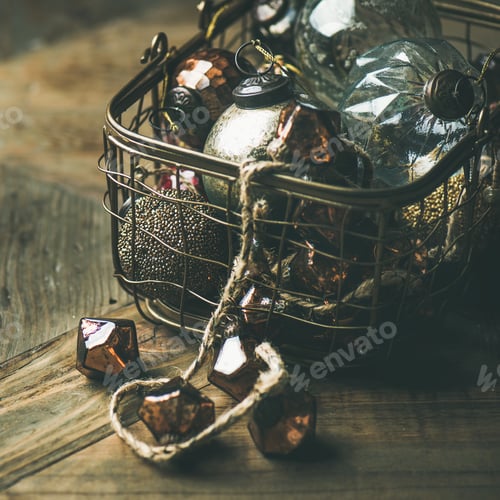 Preview: Christmas decoration balls in basket over wooden background, square crop