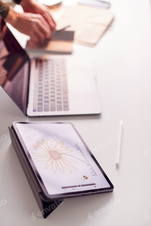 Preview: Close Up Of Desk Of Graphic Designer With Image Drawn On Digital Tablet