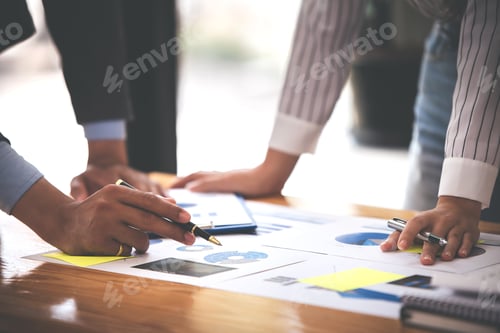 Preview: Team work with business analytic price chart on the table at the conference room.