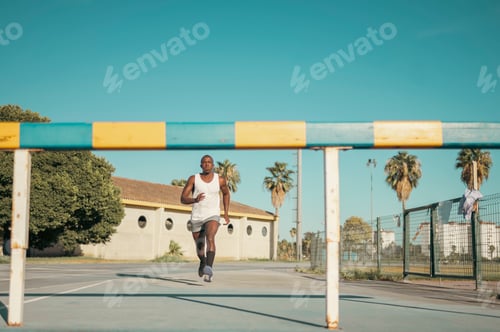Preview: Athlete man running during outdoor hurdle training