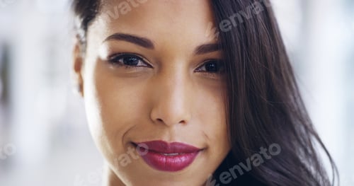 Preview: Cropped shot of a confident young businesswoman working in a modern office