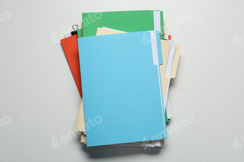 Preview: Many documents in folders with binder clips on light grey background, top view