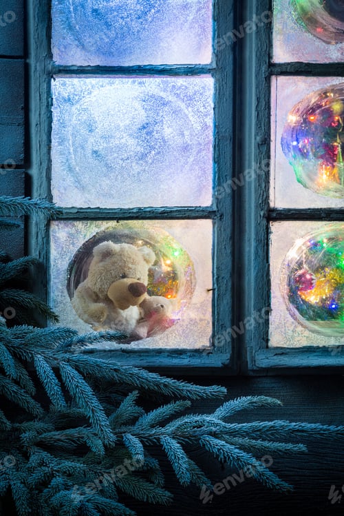 Preview: Teddy bear in frozen window for Christmas