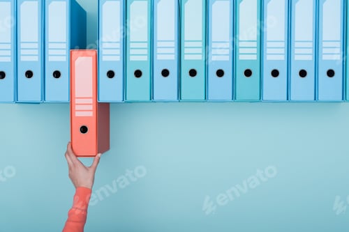 Preview: Office worker taking a folder in the archive