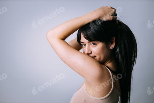 Preview: Beautiful girl posing in studio for a "body positivity" photo session