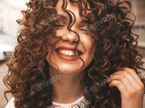 Preview: Portrait of young funny woman posing outdoors