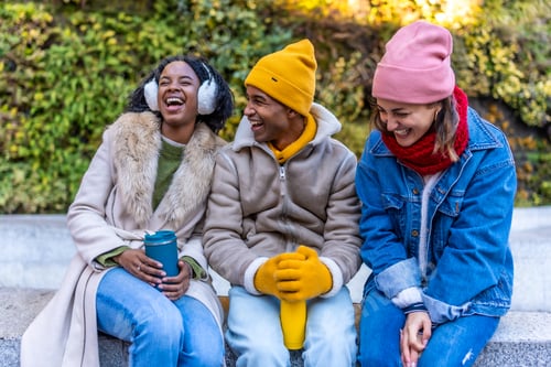 Preview: Happy multi ethnic friends laughing and enjoying winter day together outdoor