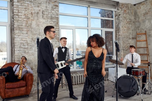 Preview: Repetition of multi ethnic jazz band in loft. Bass guitar player, electric guitar player