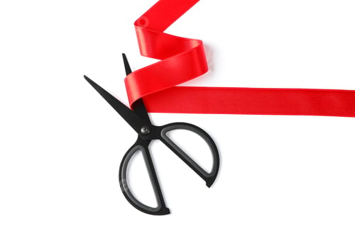 Preview: Red ribbon and scissors isolated on white background. Gift concept