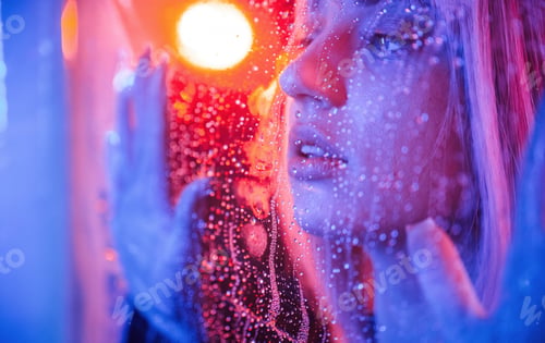 Preview: Feeling good, sensual look. Stylish woman with white hair is behind wet transparent plastic sheet