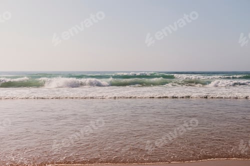Preview: landscape beach in Portugal. Sunset, relax and holidays concept. Sea with waves in Atlantic Ocean