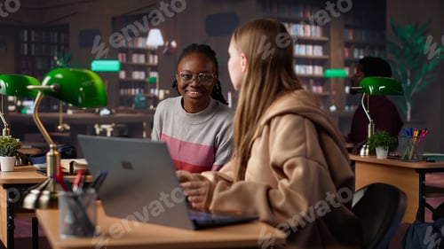 Preview: Female student reading and writing detailed notes for an exam