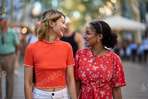 Preview: Multi-ethnic couple walking together in a crowded street
