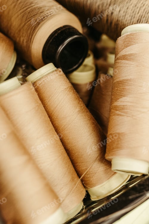 Preview: Closeup shot of colorful spools of fabric thread