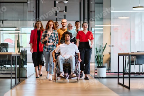 Preview: A diverse group of young business people walking a corridor in the glass-enclosed office of a modern
