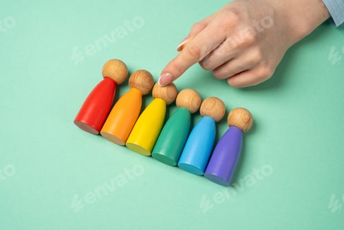 Preview: Hand chooses figures of people among LGBT representatives.